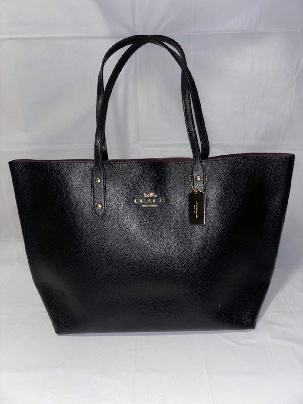 Coach Black Leather Tote with Gold Hardware and Maroon Interior Trim